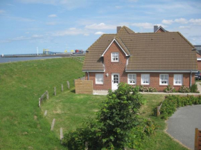 Direkt am Deich - Ferienwohnung Oland im Gästehaus Am Badedeich